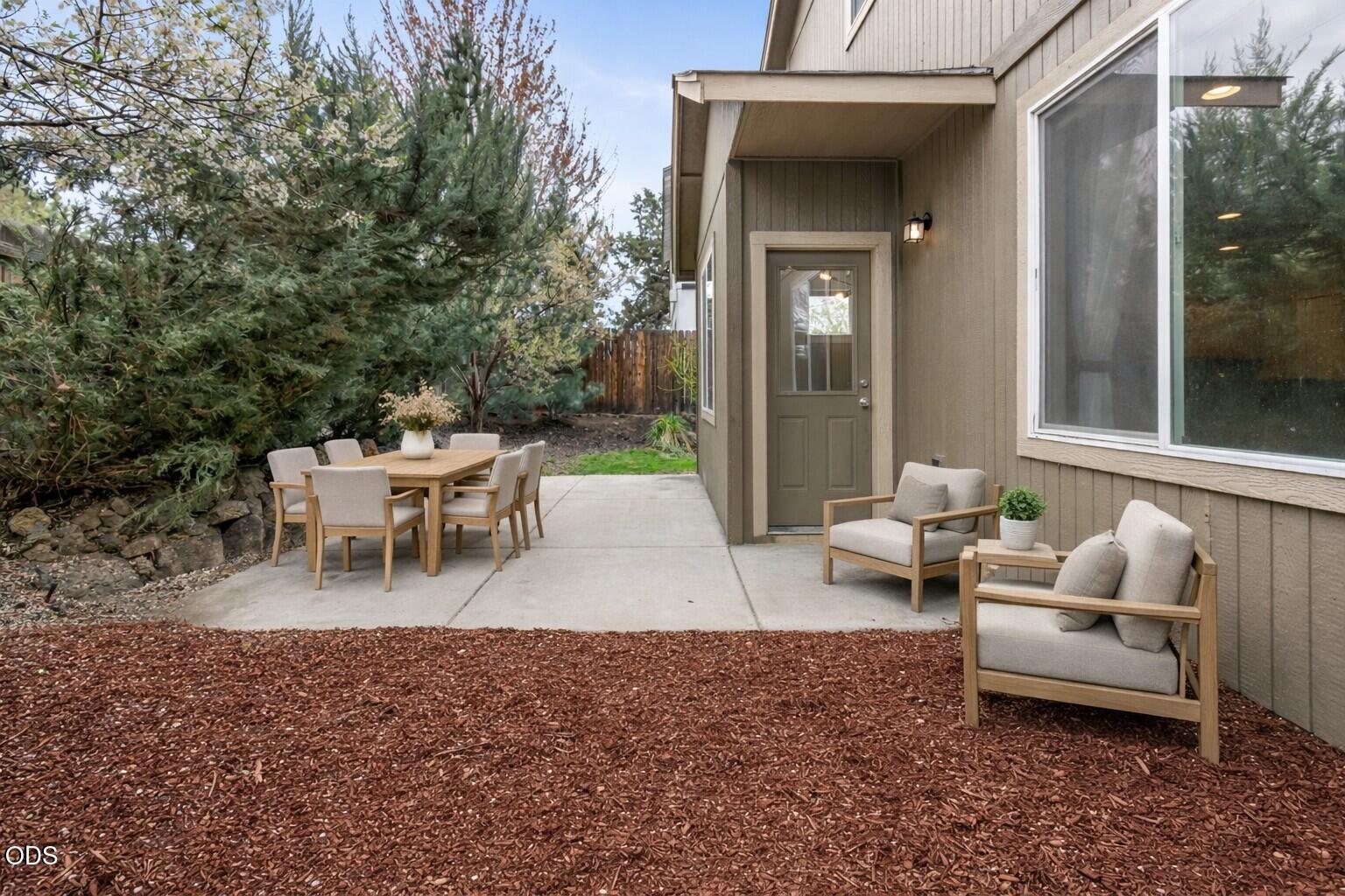 21332 Oconnor Way Bend, OR 97701 - Photo 30 of 33 a view of a patio with a dining table and chairs