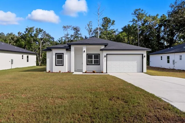 a house with trees in the background