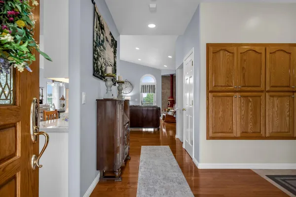 a spacious bedroom with a bed and a large window