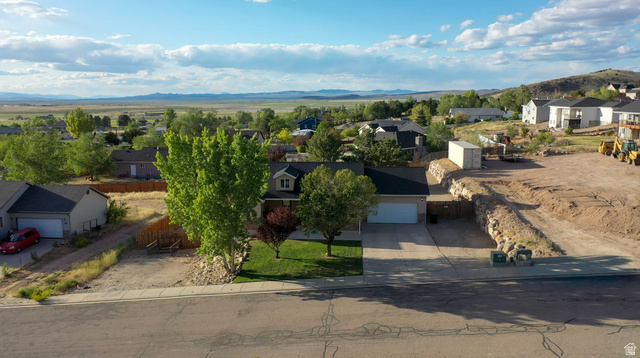 1797 Sunset Road Enoch, UT 84721 - Photo 80 of 80 Ranch-style residence featuring an attached two-car garage, established front yard landscaping, and a concrete driveway
