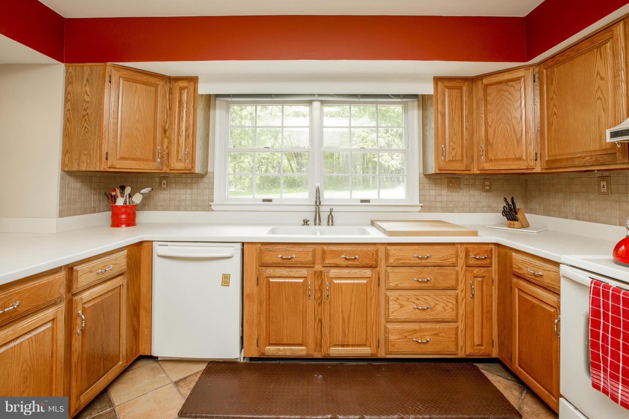 7246 Bowers Road Frederick, MD 21702 - Photo 14 of 30 a kitchen with stainless steel appliances sink cabinets and window
