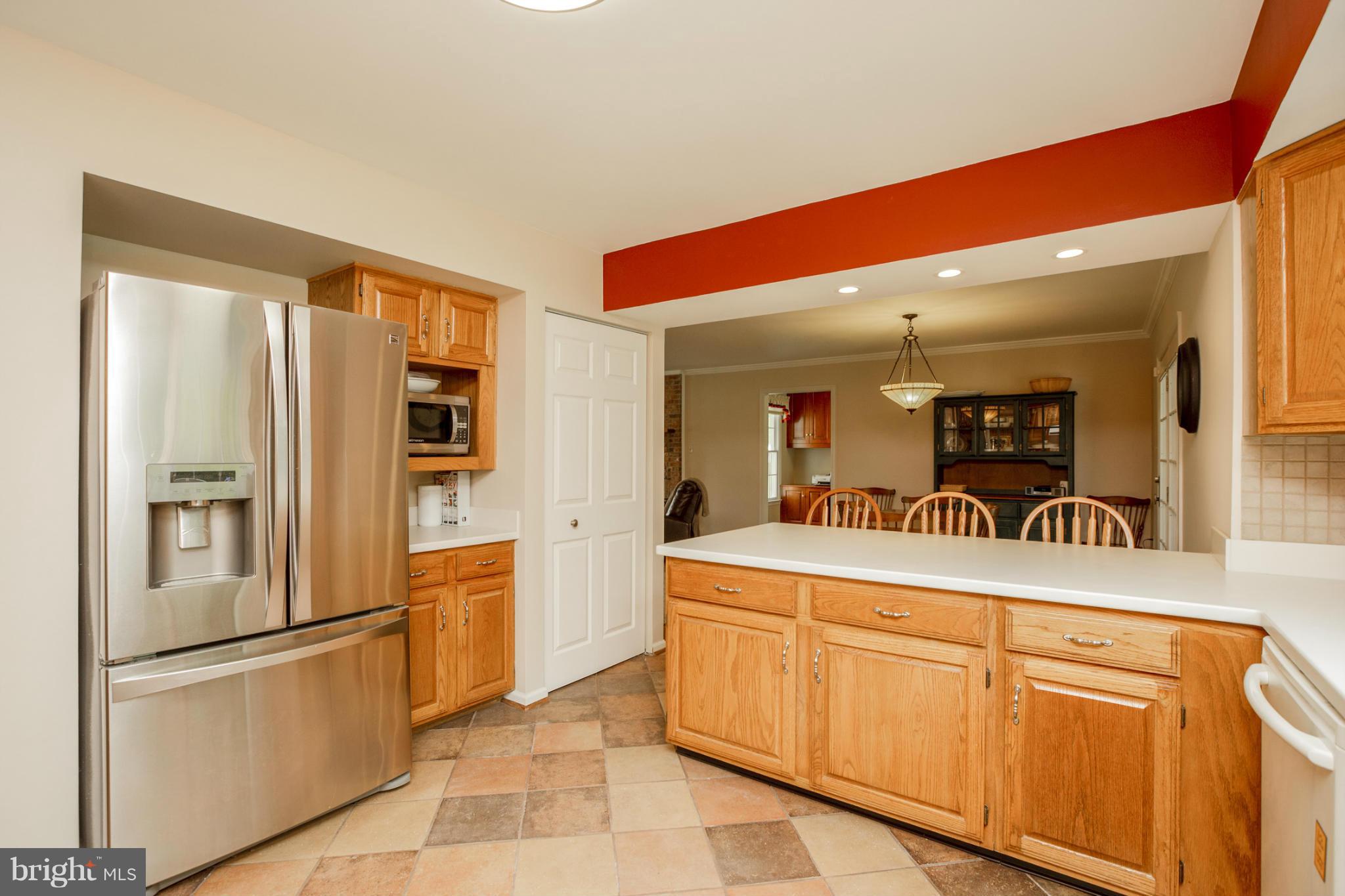 7246 Bowers Road Frederick, MD 21702 - Photo 15 of 30 a kitchen with stainless steel appliances granite countertop a refrigerator and a stove