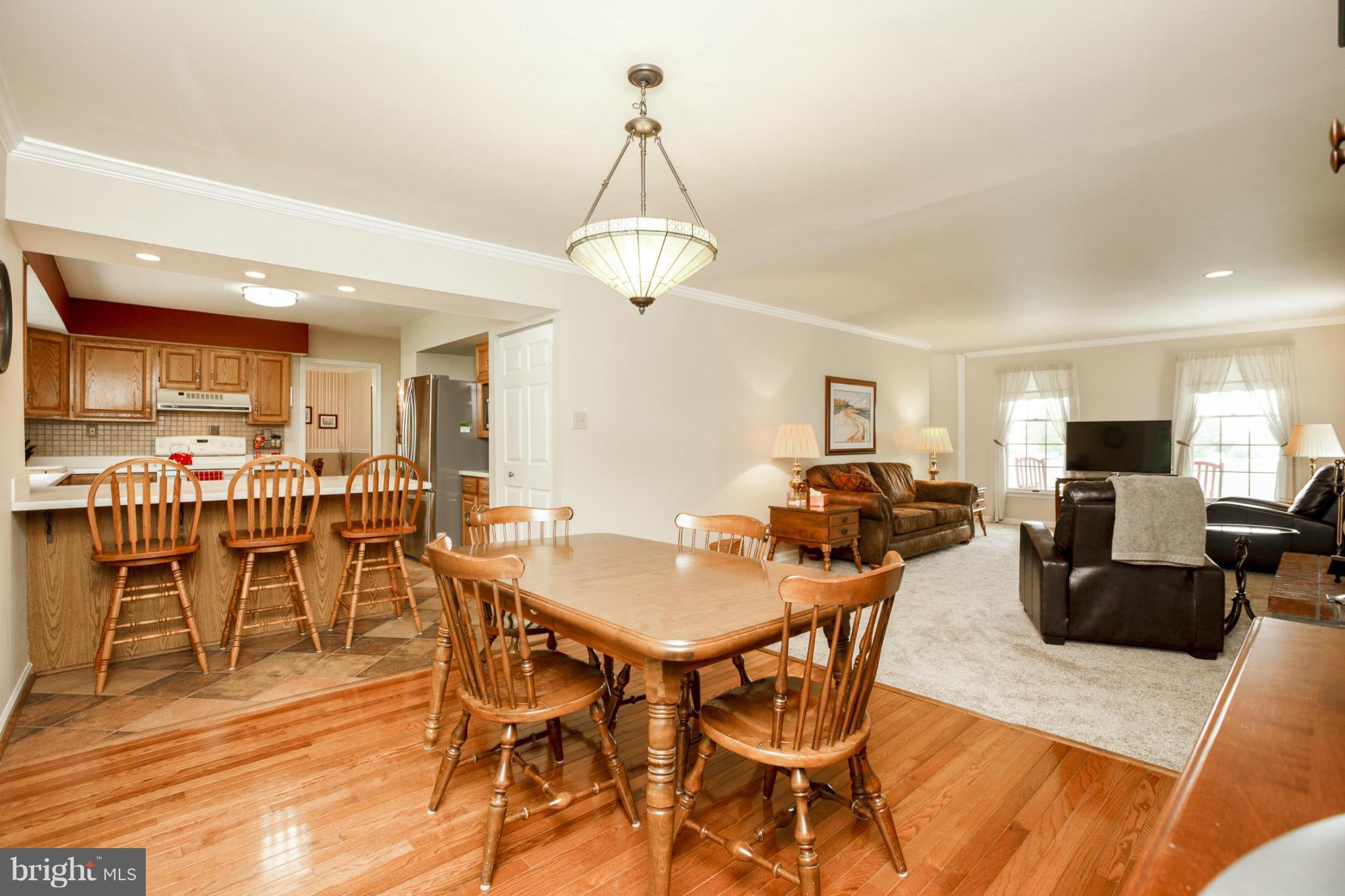 7246 Bowers Road Frederick, MD 21702 - Photo 16 of 30 a view of a dining room with furniture