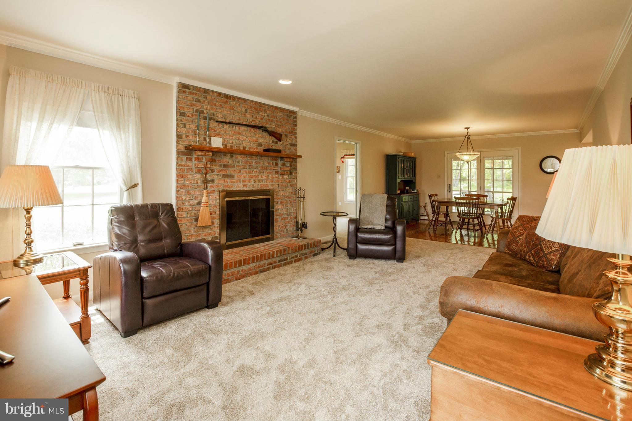 7246 Bowers Road Frederick, MD 21702 - Photo 18 of 30 a living room with furniture and a fireplace