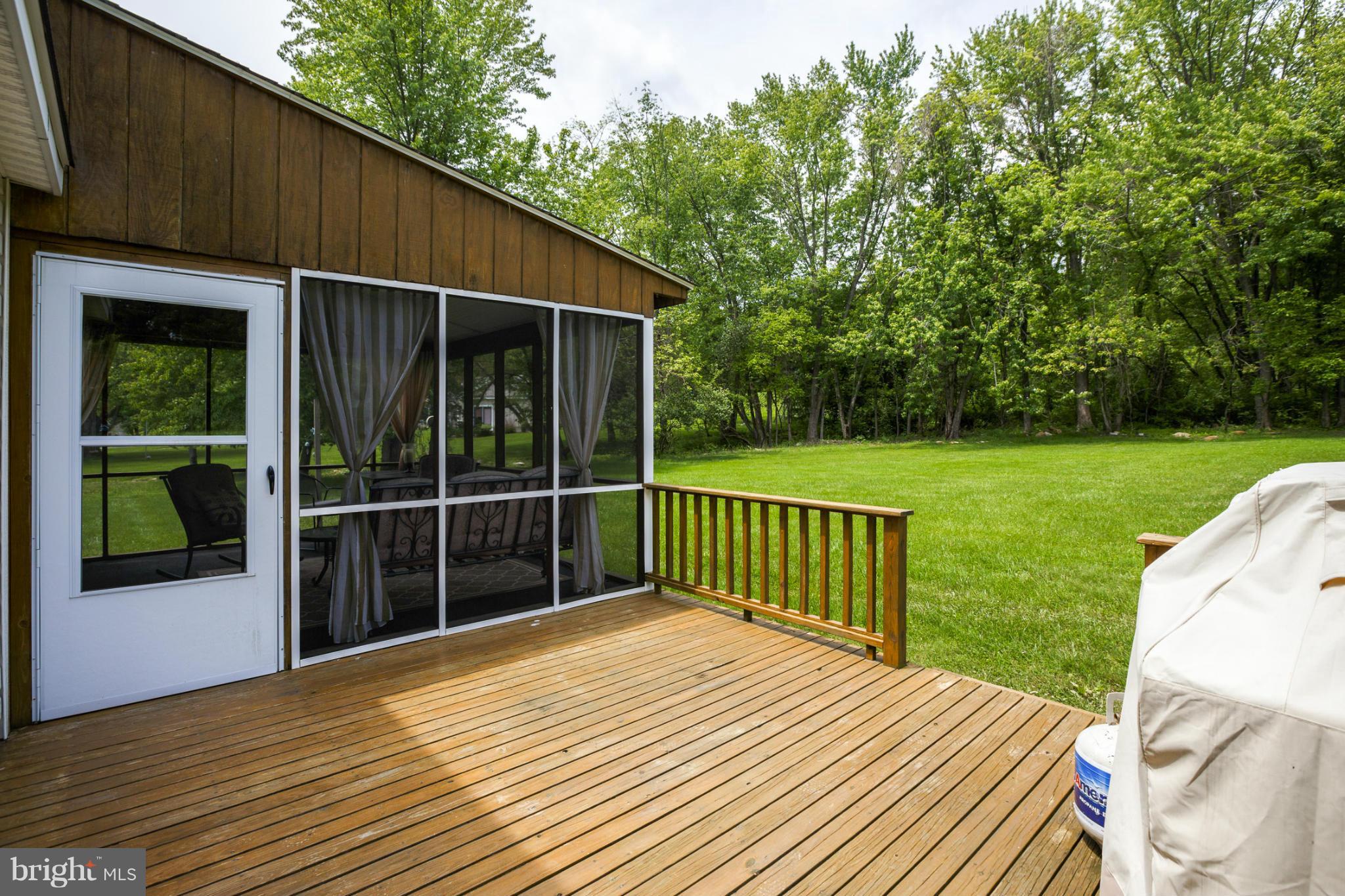 7246 Bowers Road Frederick, MD 21702 - Photo 6 of 30 a view of a backyard with a deck