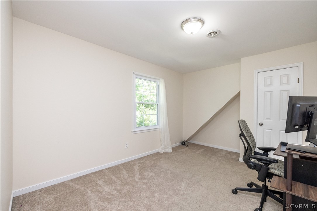 7436 Drexelbrook Road Chesterfield, VA 23832 - Photo 18 of 31 a view of a workspace with furniture and a window