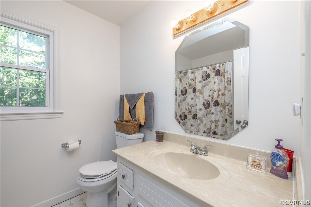 7436 Drexelbrook Road Chesterfield, VA 23832 - Photo 21 of 31 a bathroom with a sink vanity mirror and toilet