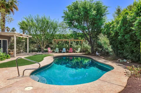 a view of a swimming pool with a patio