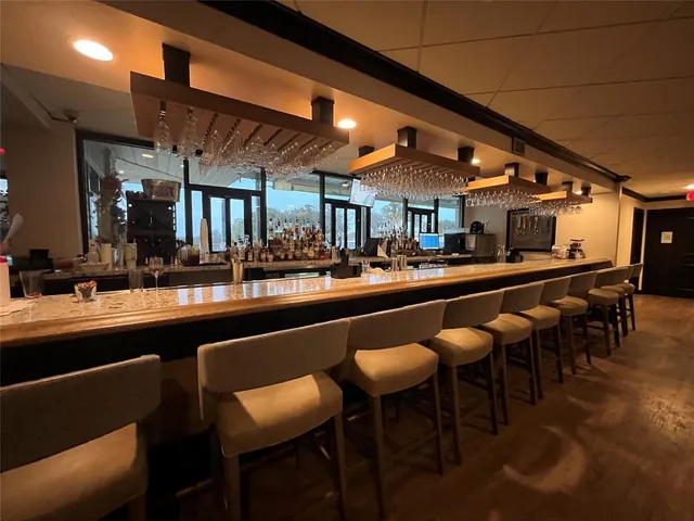 a living room with furniture a rug and a projector