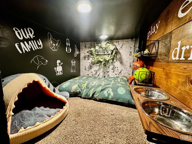 a bedroom with a bed and a painting on the wall