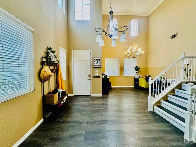 a view of an entryway with wooden floor