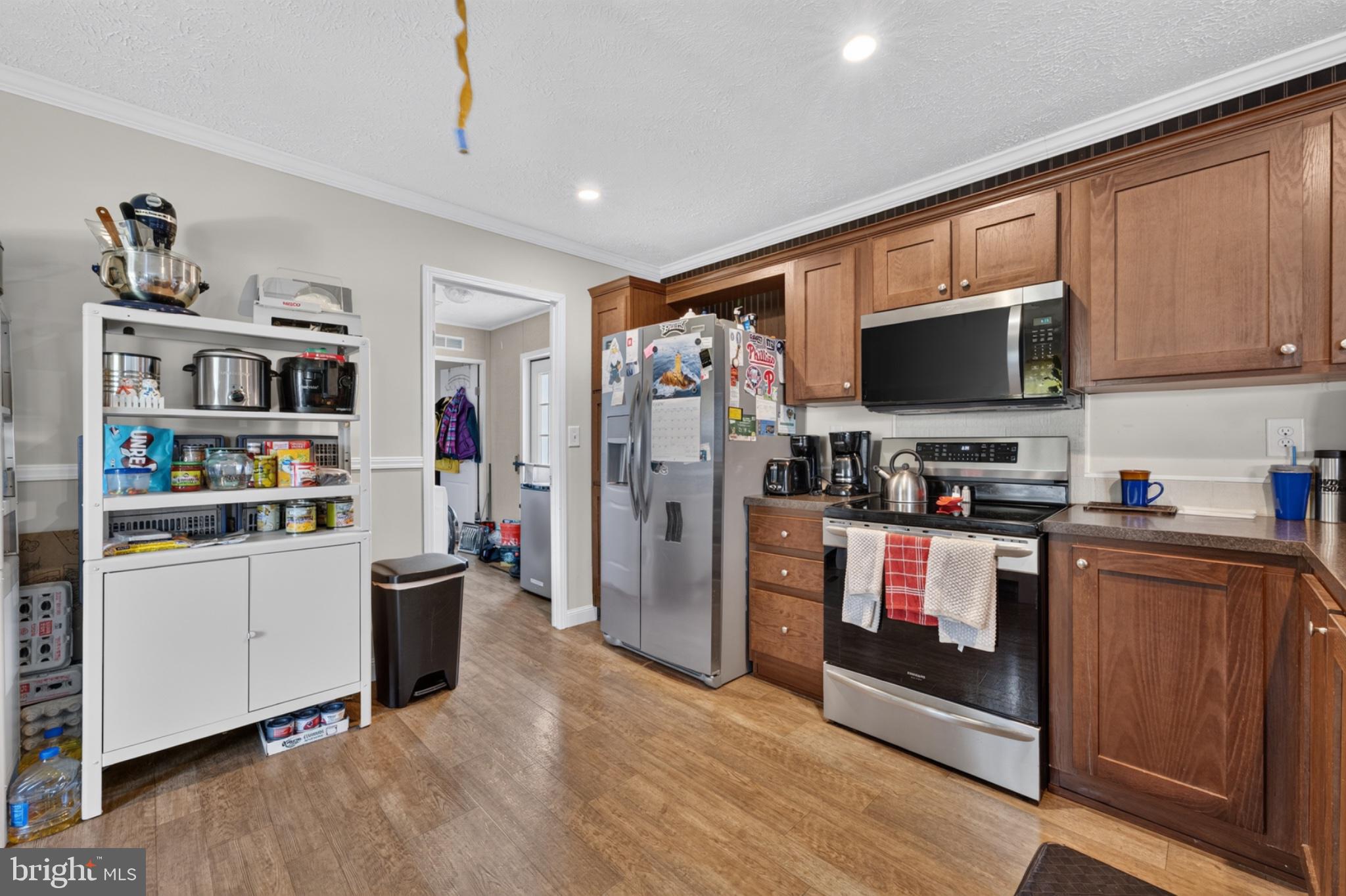 412 Ranee Loop Bear, DE 19701 - Photo 12 of 24 Modern kitchen with warm wood accents.