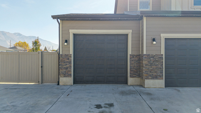 368 East 700 North Springville, UT 84663 - Photo 48 of 55 Garage with a gate, a mountain view, and driveway