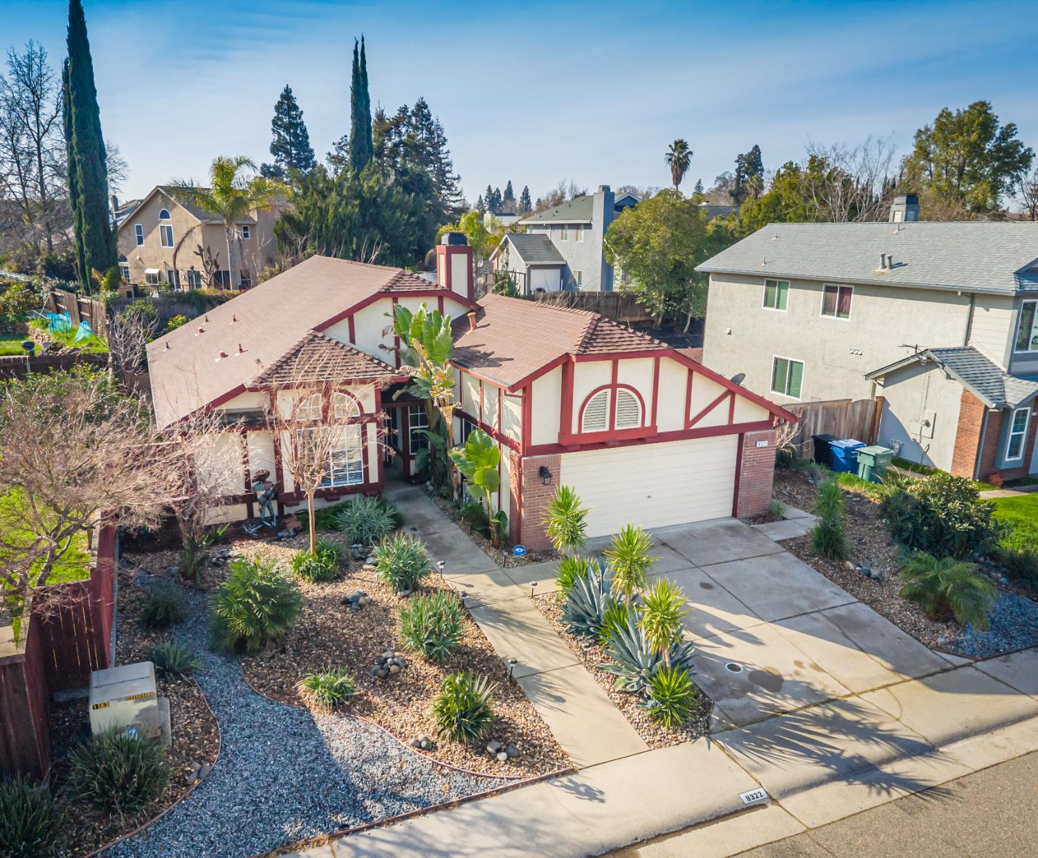8322 Rambleton Way Antelope, CA 95843 - Photo 1 of 1 a view of a house with a yard and potted plants