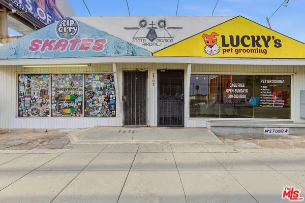 a view of a room with gym equipment and large window