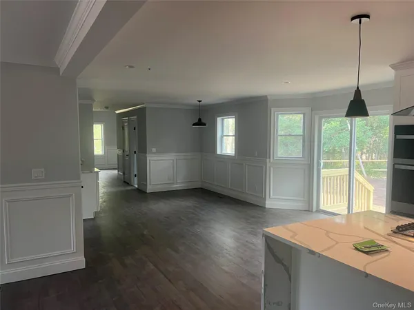 a view of a room with water heater and windows