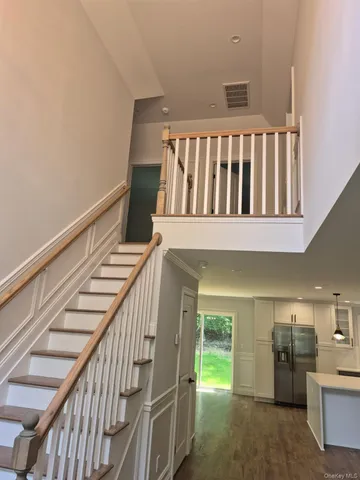 a view of entryway with kitchen