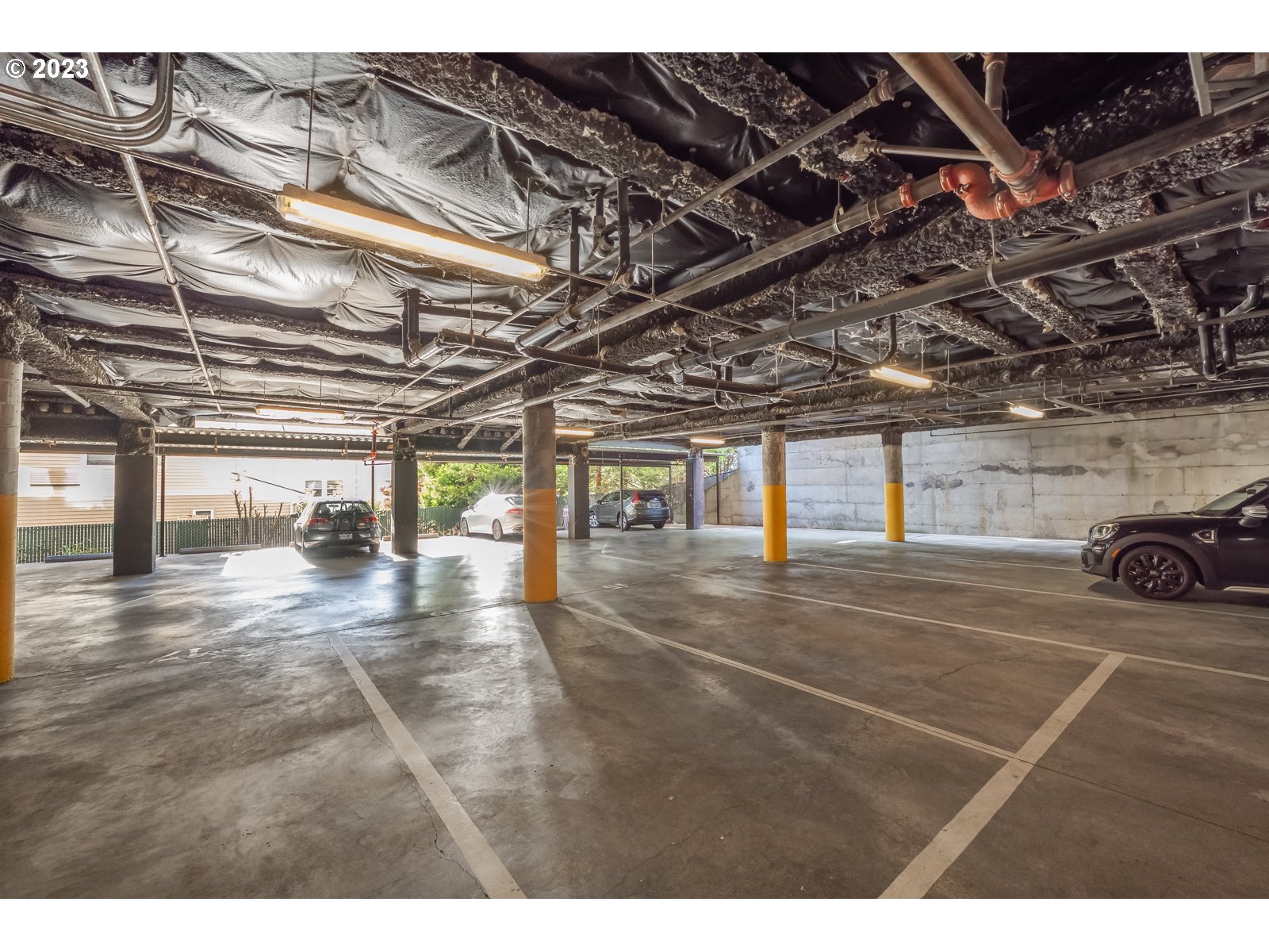 8712 North Decatur Street, Unit 201 Portland, OR 97203 - Photo 28 of 40 a view of parking garage with a lots of windows