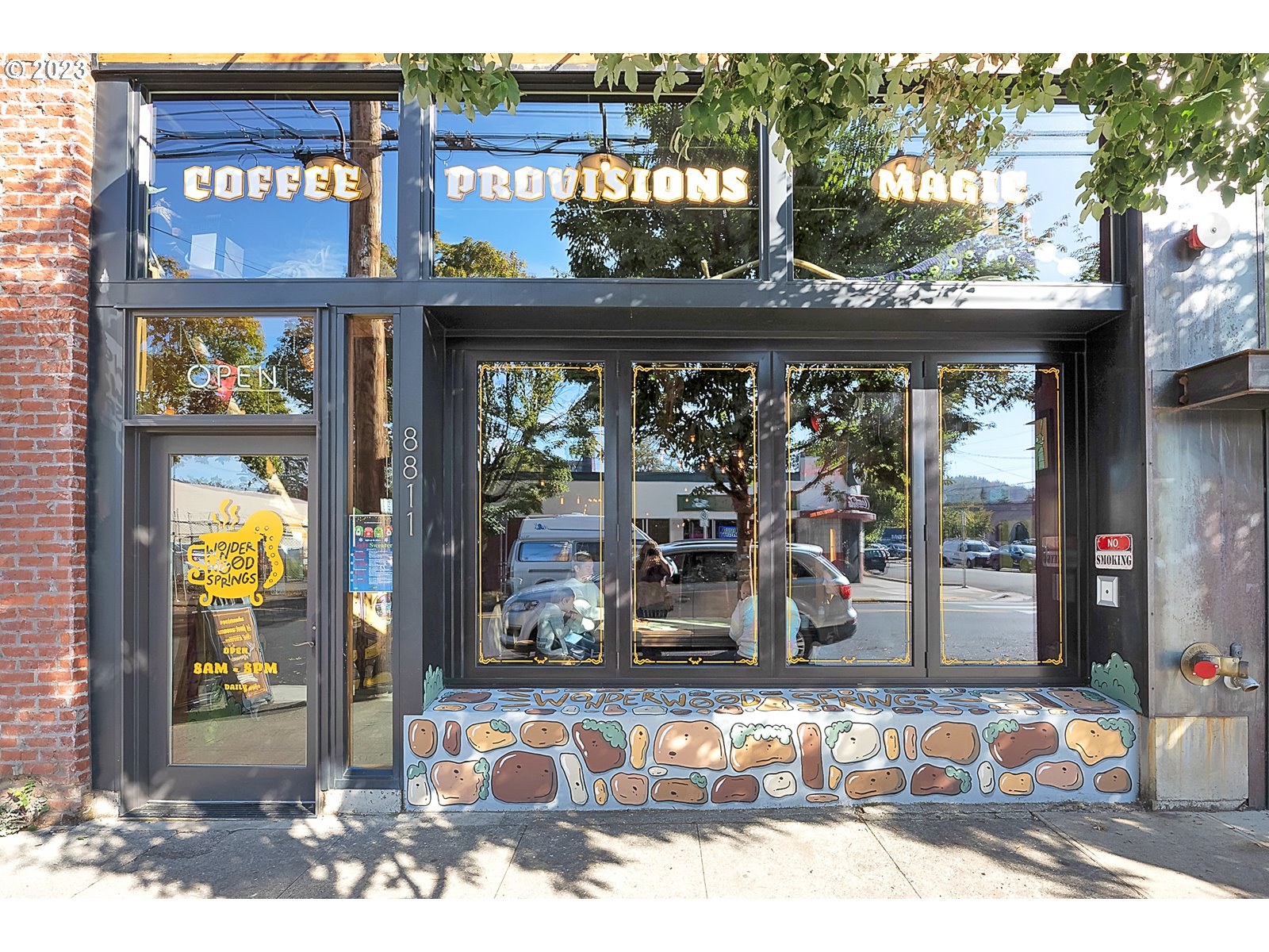 8712 North Decatur Street, Unit 201 Portland, OR 97203 - Photo 29 of 40 a view of a brick building with a lot of windows
