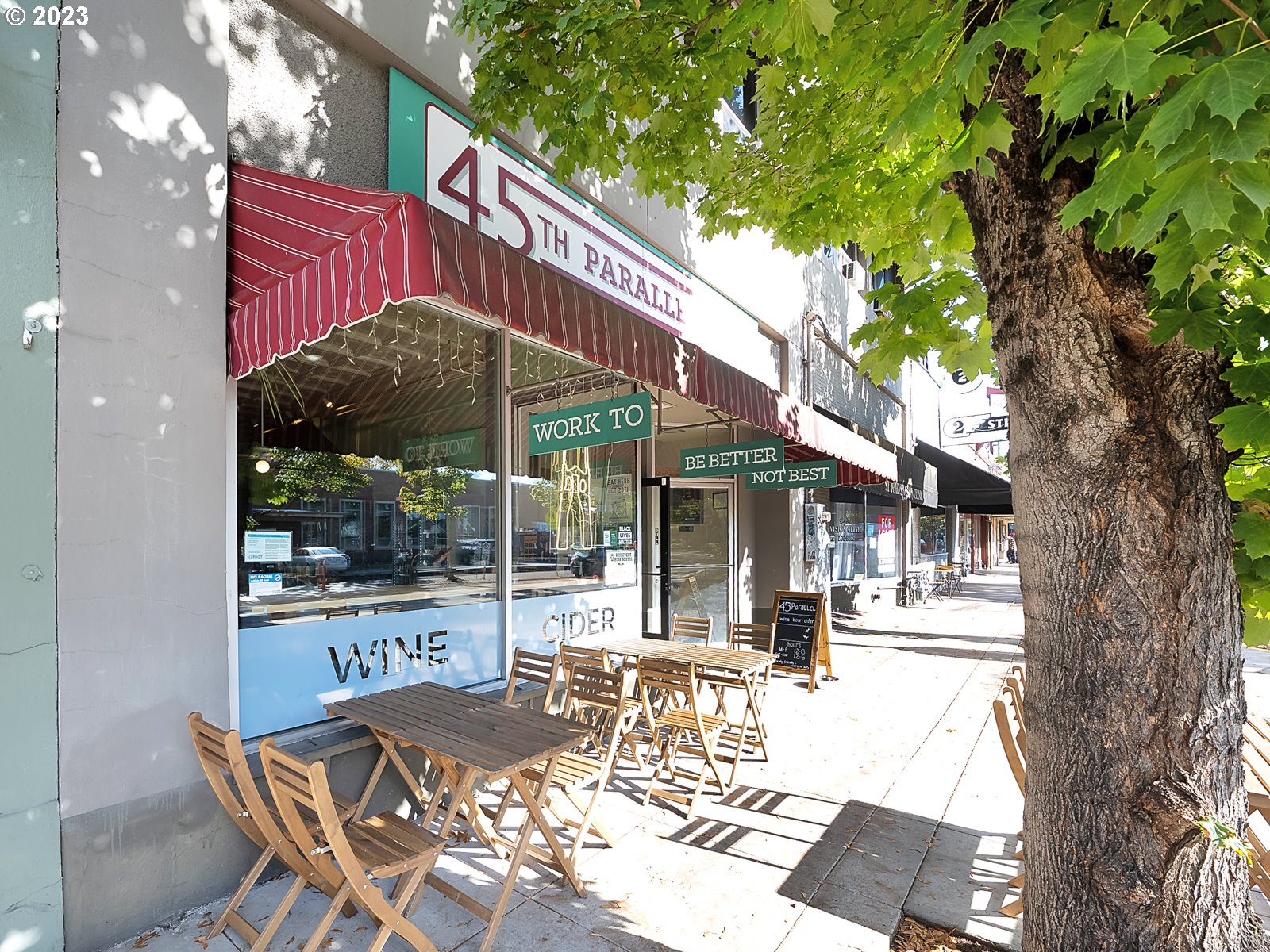 8712 North Decatur Street, Unit 201 Portland, OR 97203 - Photo 39 of 40 a view of a patio with table and chairs and floor to ceiling window