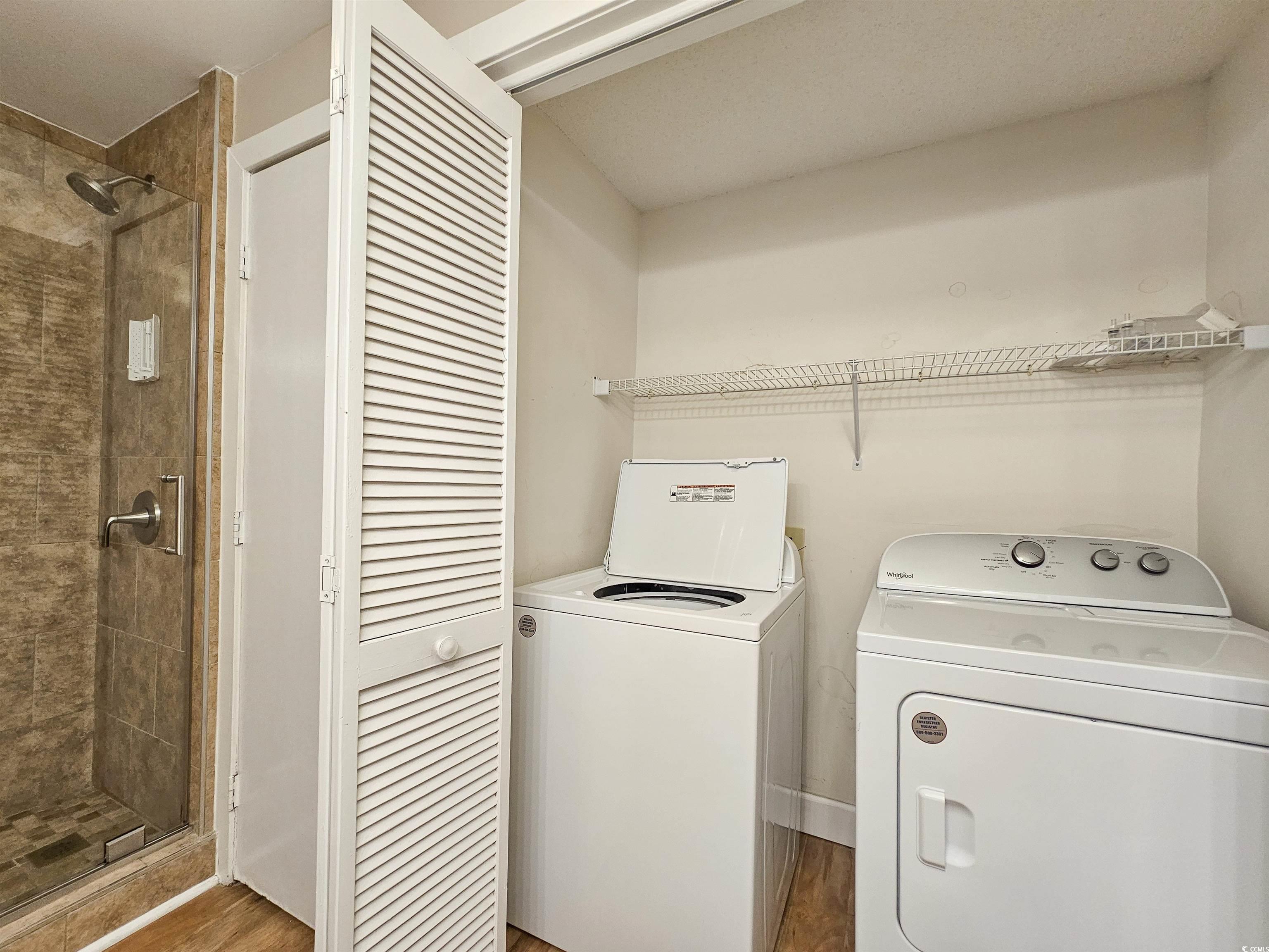 709 Appleby Way, Unit 7C Myrtle Beach, SC 29572 - Photo 24 of 40 Washroom featuring washing machine and dryer and wood finished floors