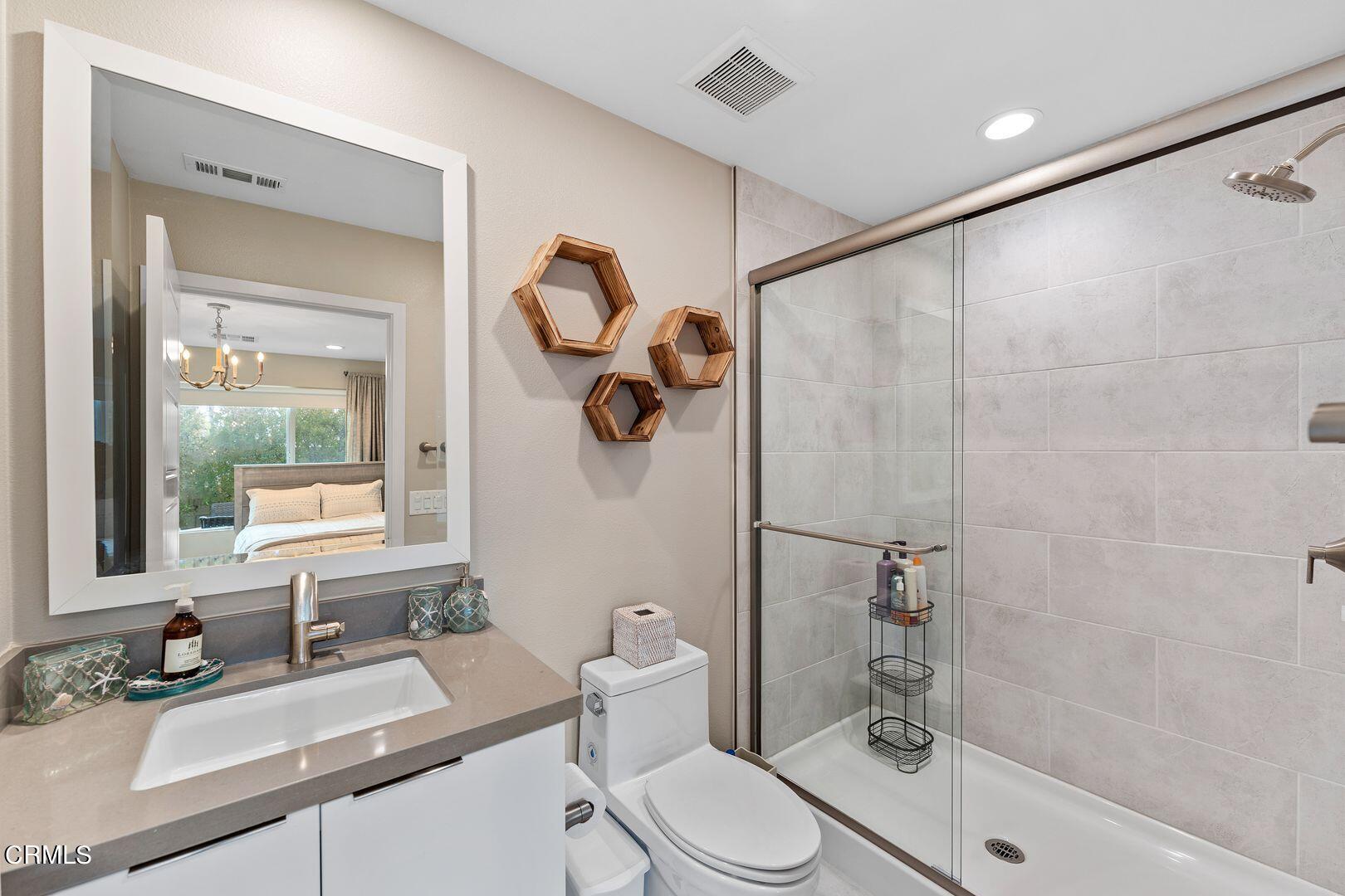 1028 Harbor Boulevard Oxnard, CA 93035 - Photo 12 of 48 a bathroom with a sink a toilet and shower