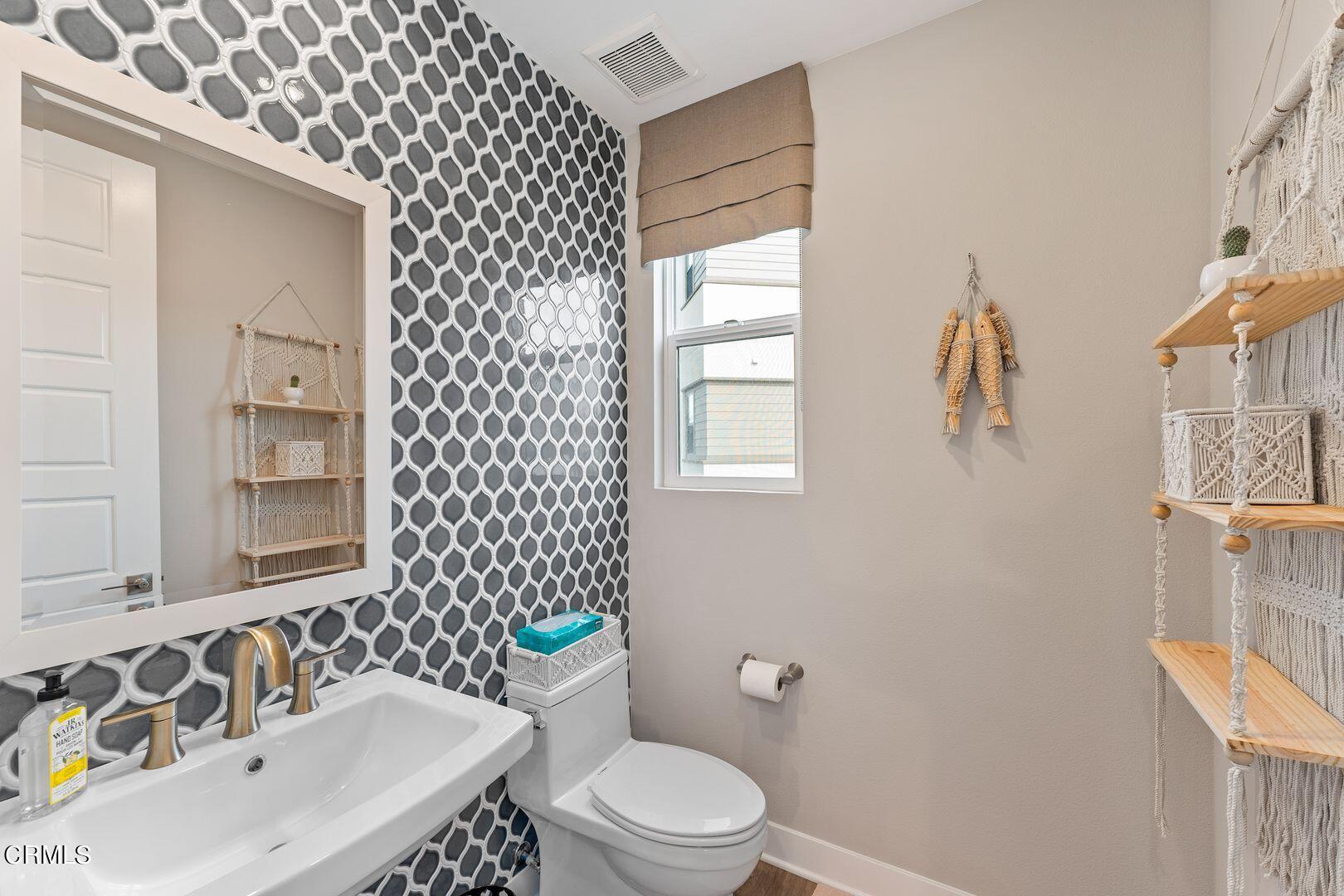 1028 Harbor Boulevard Oxnard, CA 93035 - Photo 13 of 48 a bathroom with a sink toilet and shower