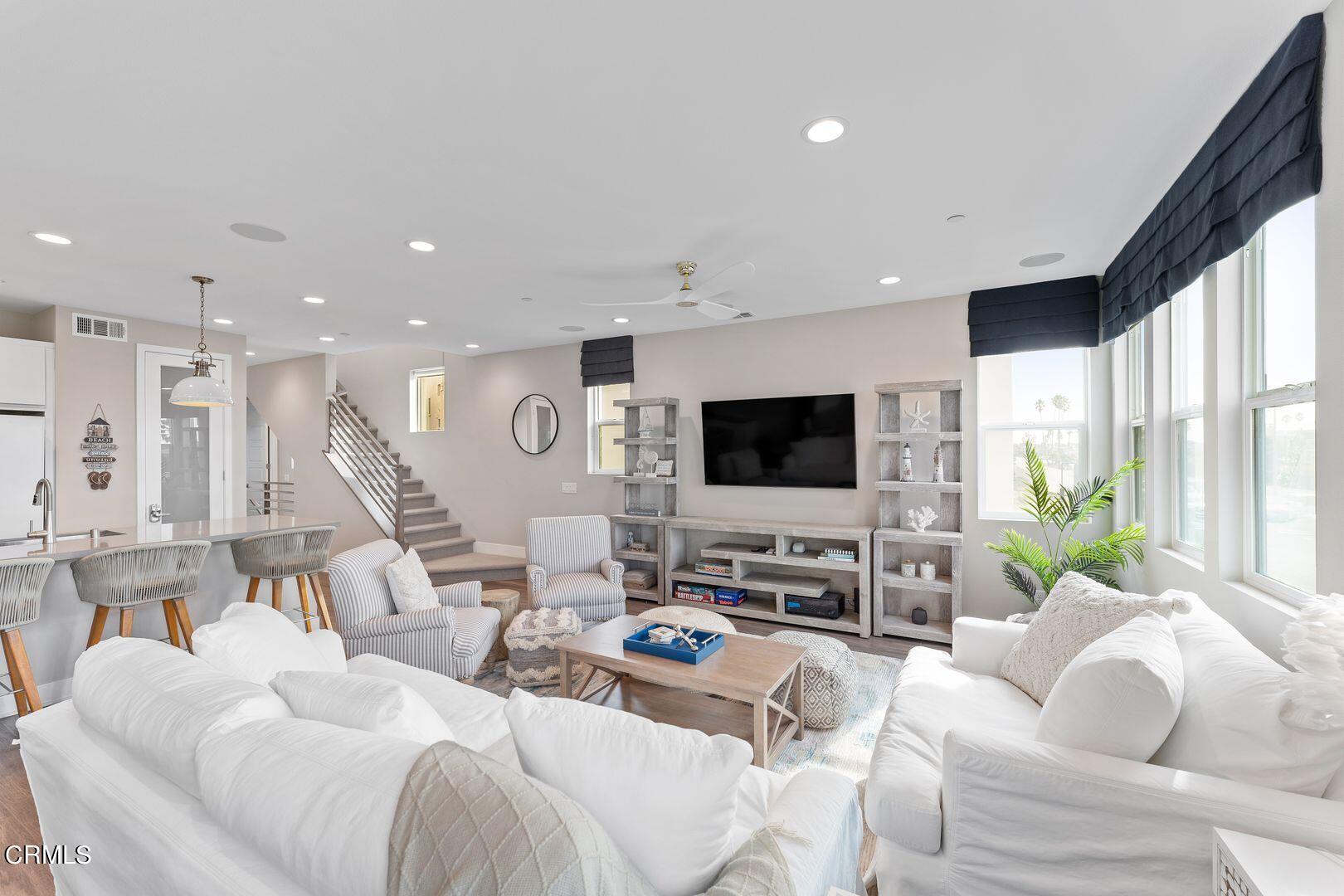 1028 Harbor Boulevard Oxnard, CA 93035 - Photo 19 of 48 a living room with furniture flat screen tv and a large window