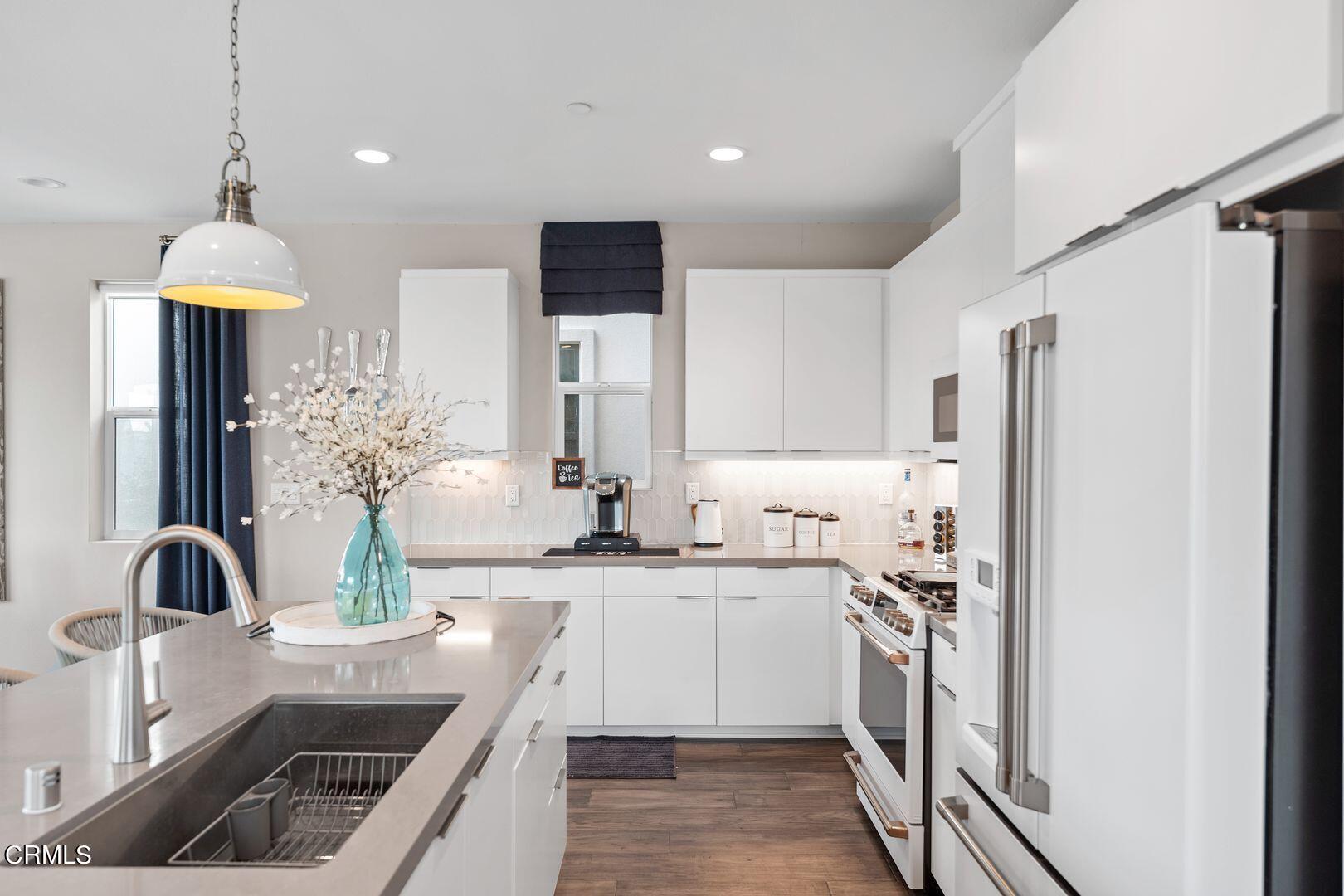 1028 Harbor Boulevard Oxnard, CA 93035 - Photo 26 of 48 a kitchen with stainless steel appliances a sink stove and refrigerator