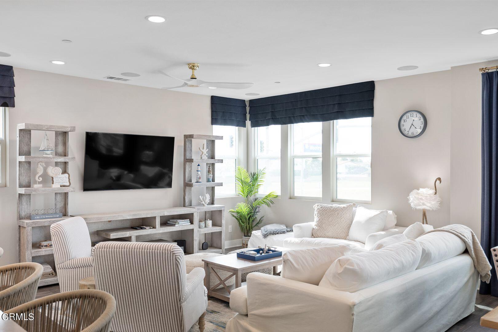 1028 Harbor Boulevard Oxnard, CA 93035 - Photo 32 of 48 a living room with furniture and a flat screen tv