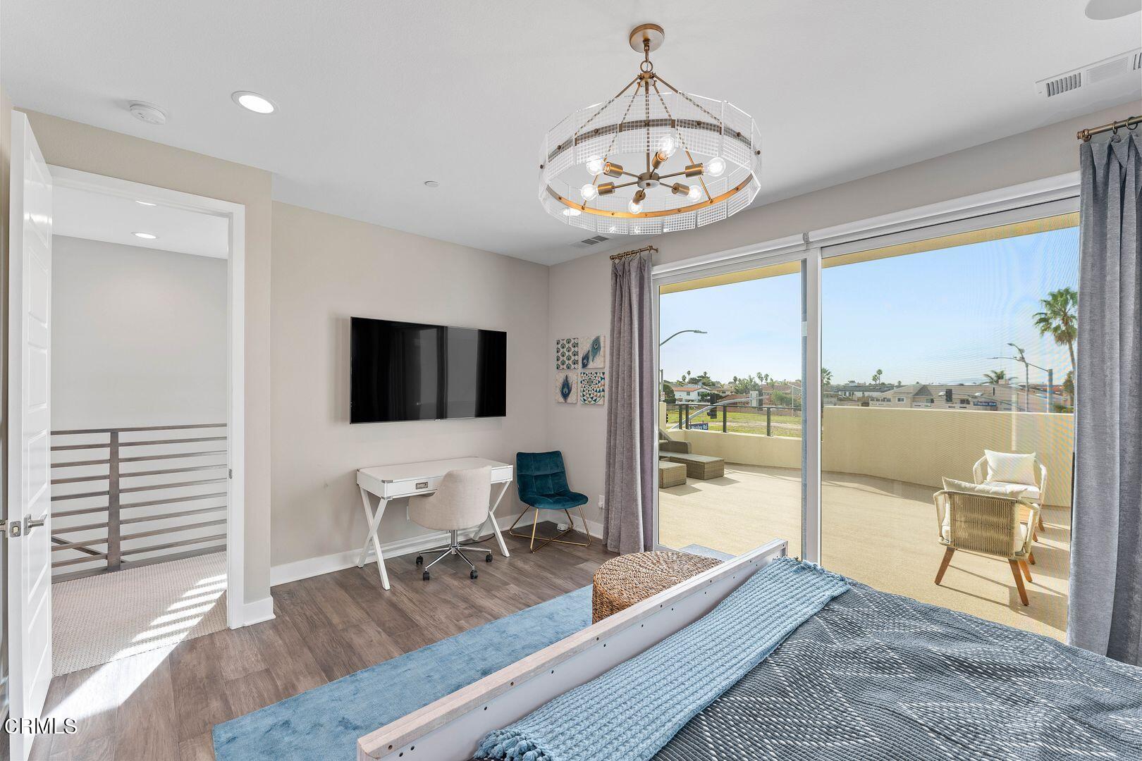 1028 Harbor Boulevard Oxnard, CA 93035 - Photo 39 of 48 a view of a livingroom with furniture wooden floor and windows