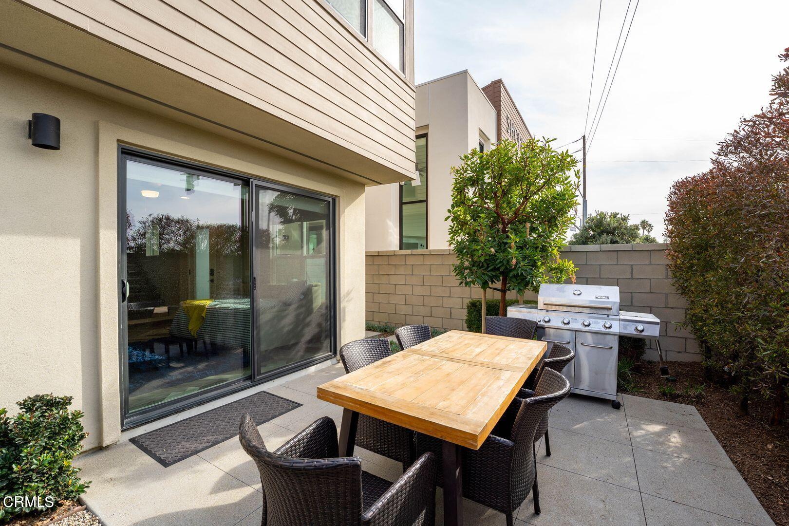 1028 Harbor Boulevard Oxnard, CA 93035 - Photo 43 of 48 a backyard of a house with barbeque oven table and chairs