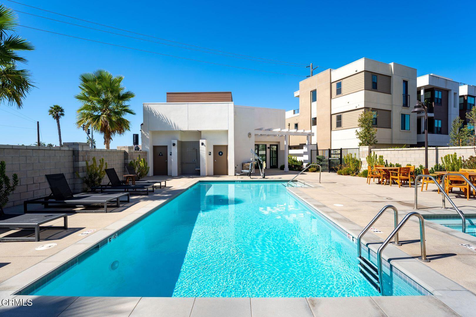 1028 Harbor Boulevard Oxnard, CA 93035 - Photo 46 of 48 a swimming pool with outdoor seating and yard