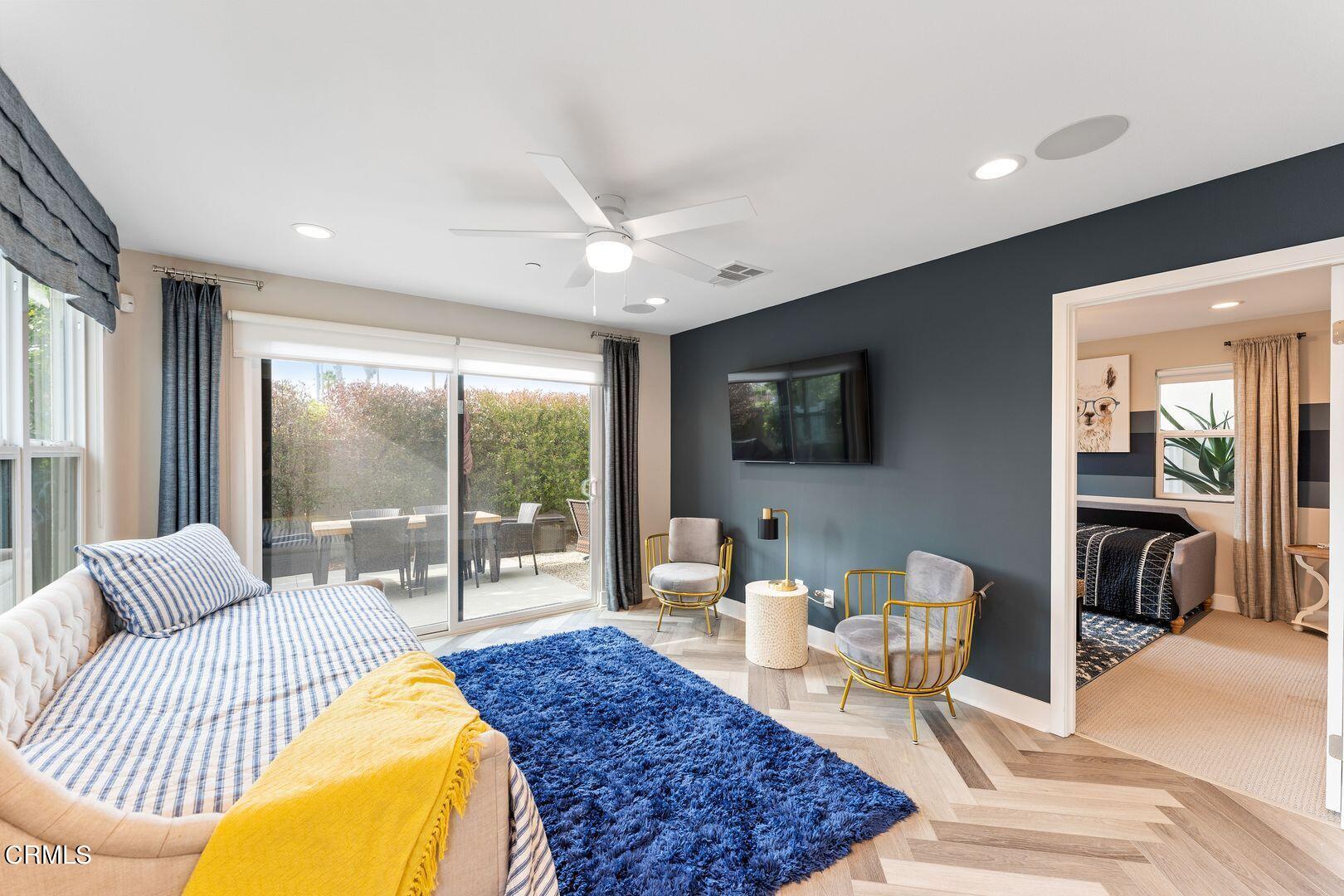 1028 Harbor Boulevard Oxnard, CA 93035 - Photo 8 of 48 a living room with furniture a flat screen tv and a large window