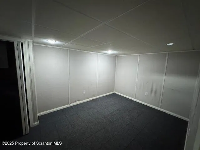 a view of a backyard with a tree