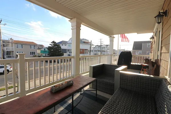 a view of a chair and table on the deck