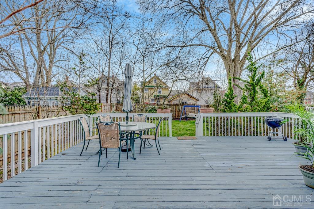 20 Codington Place Somerville, NJ 08876 - Photo 15 of 36 a view of a deck with table and chairs and wooden floor