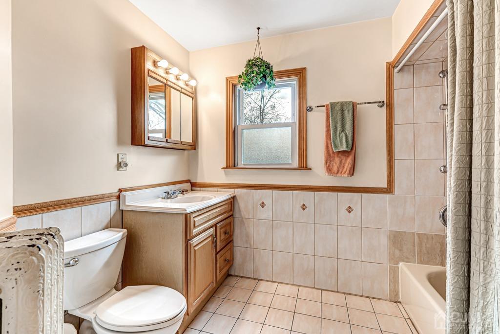 20 Codington Place Somerville, NJ 08876 - Photo 21 of 36 a bathroom with a toilet sink and mirror