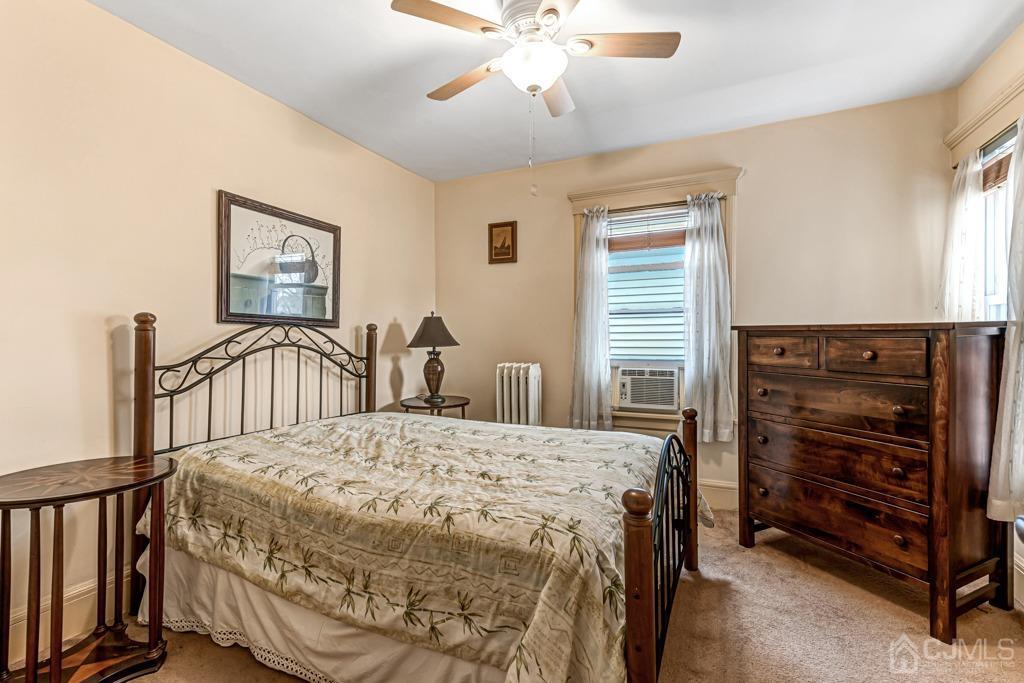 20 Codington Place Somerville, NJ 08876 - Photo 22 of 36 a bedroom with a bed and a chandelier