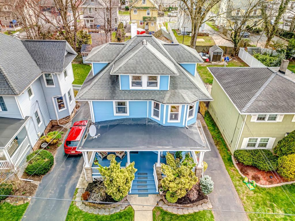 20 Codington Place Somerville, NJ 08876 - Photo 28 of 36 an aerial view of a house with a yard and potted plants
