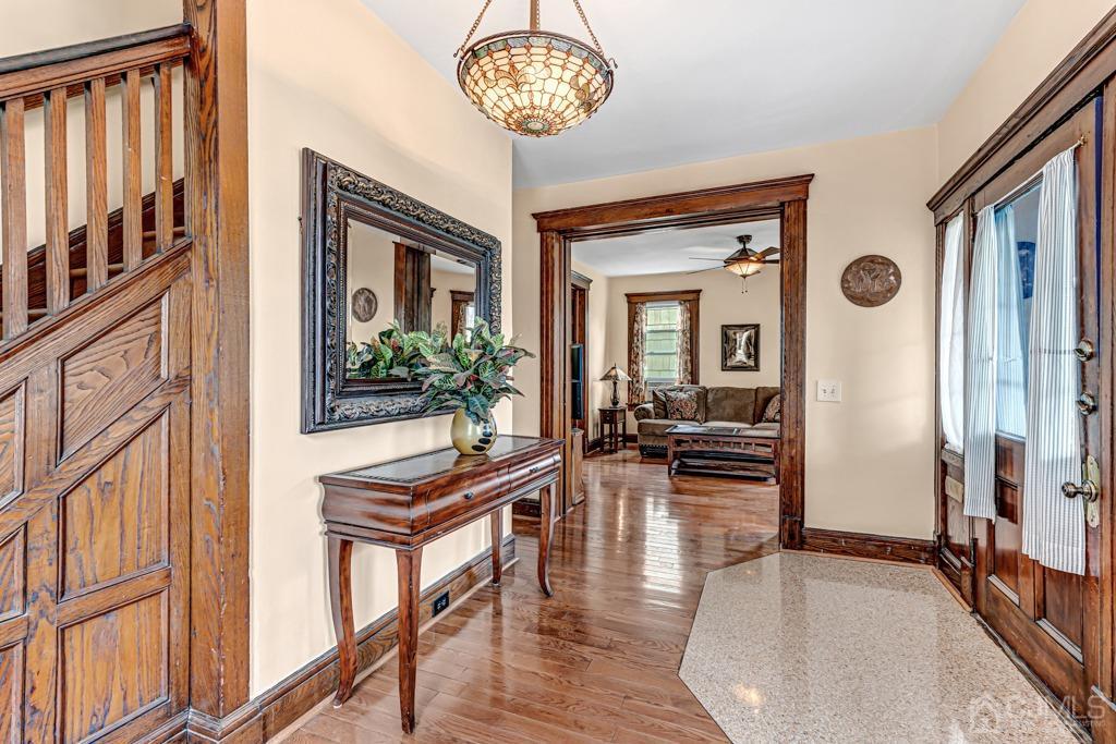 20 Codington Place Somerville, NJ 08876 - Photo 4 of 36 a view of a livingroom with furniture a dinning room and large windows