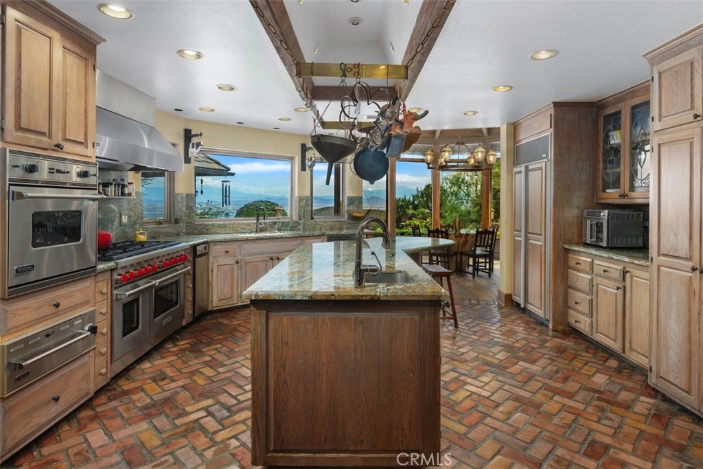 27777 Sycamore Mesa Road Temecula, CA 92590 - Photo 24 of 72 Gourmet Chef's kitchen with 8 burner Wolf cook range, 3 ovens, warming drawer and pot & pan rack