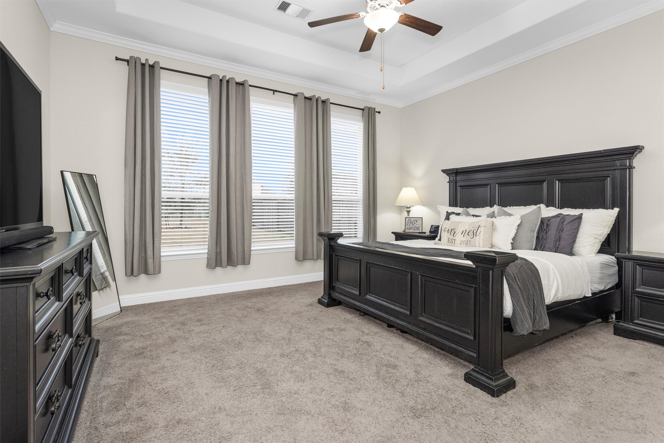 3622 Lister Drive Rosharon, TX 77583 - Photo 18 of 44 a bedroom with a bed a flat screen tv and a large window with the outer view