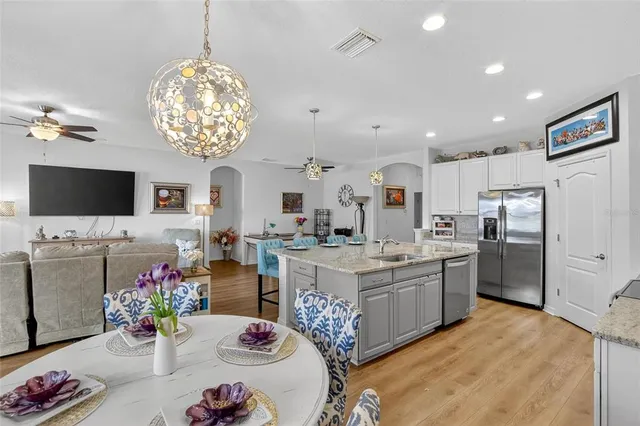 a view of a workspace with furniture and wooden floor