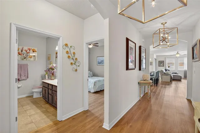 a bathroom with a sink mirror and vanity