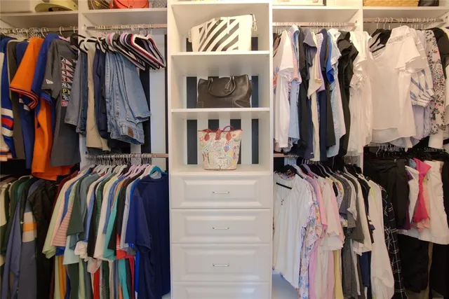 a view of a house with backyard swimming pool and sitting area