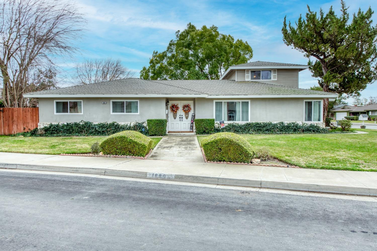 front view of a house and a small yard