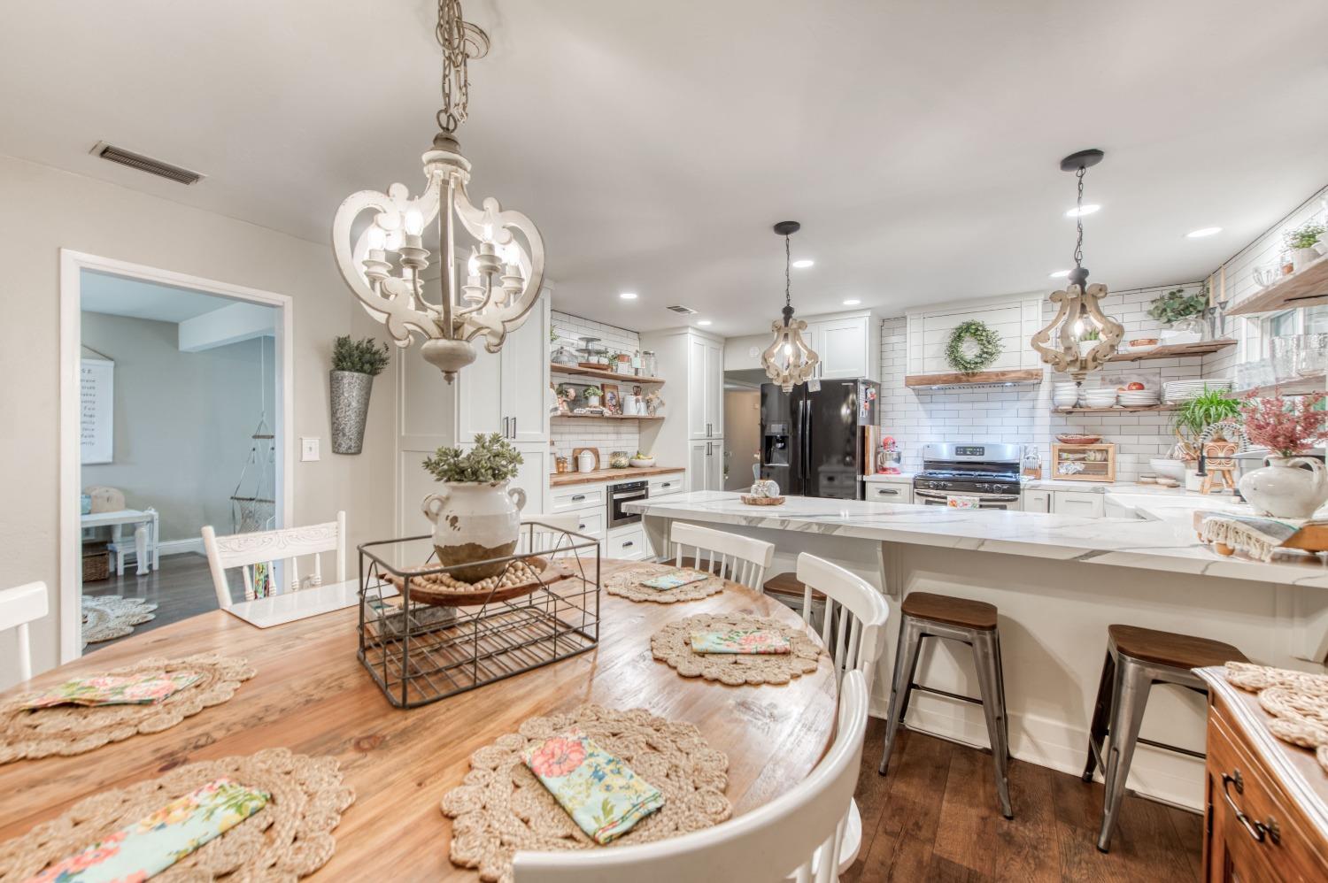 1880 East Cardella Street Firebaugh, CA 93622 - Photo 18 of 42 a large kitchen with a table and chairs