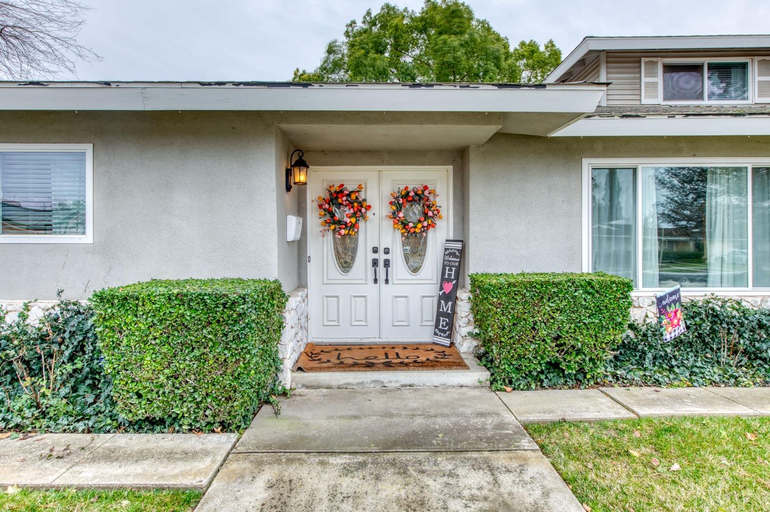 1880 East Cardella Street Firebaugh, CA 93622 - Photo 2 of 42 a front view of a house with a garden