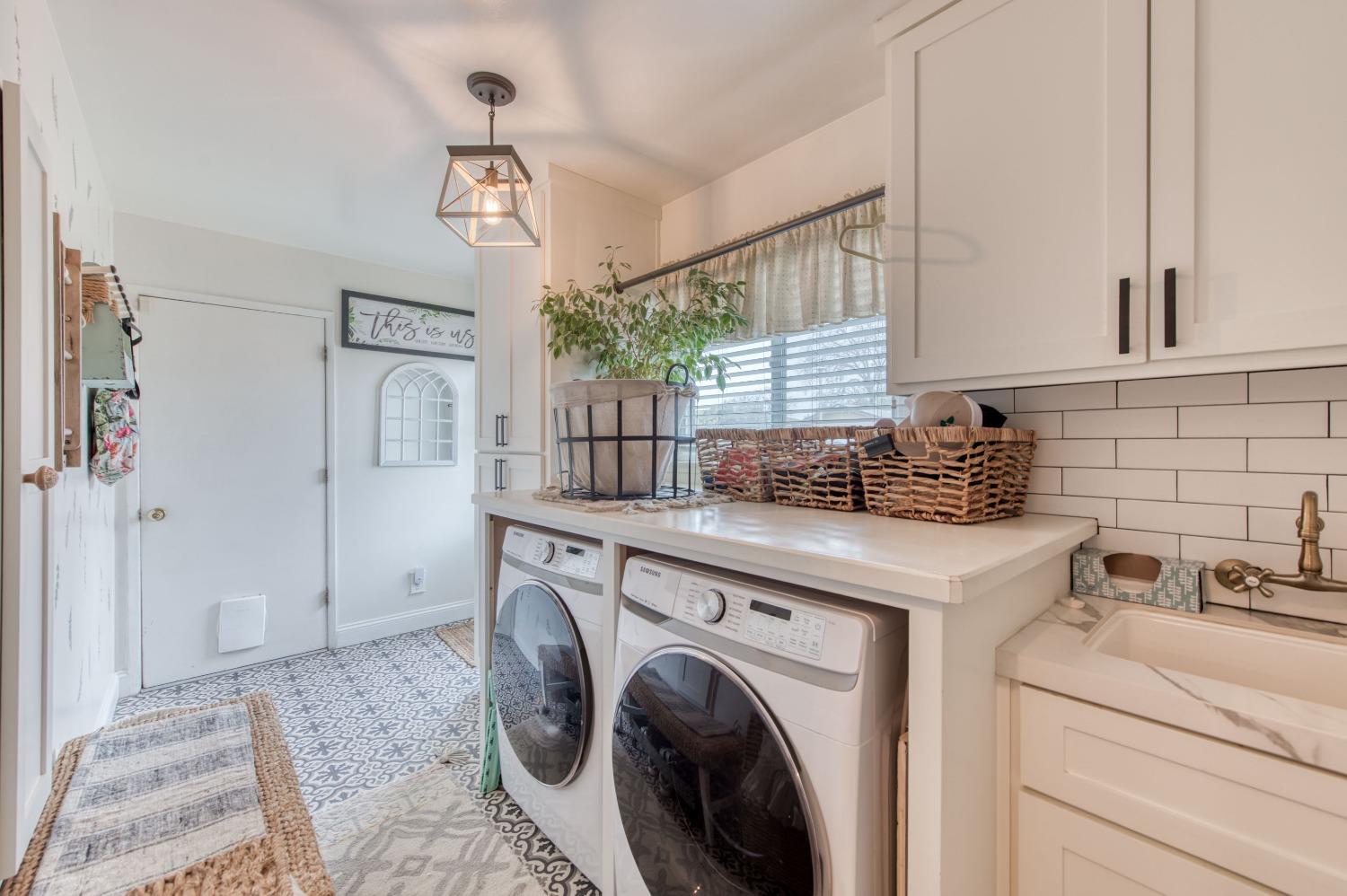 1880 East Cardella Street Firebaugh, CA 93622 - Photo 27 of 42 a kitchen that has a sink and a stove